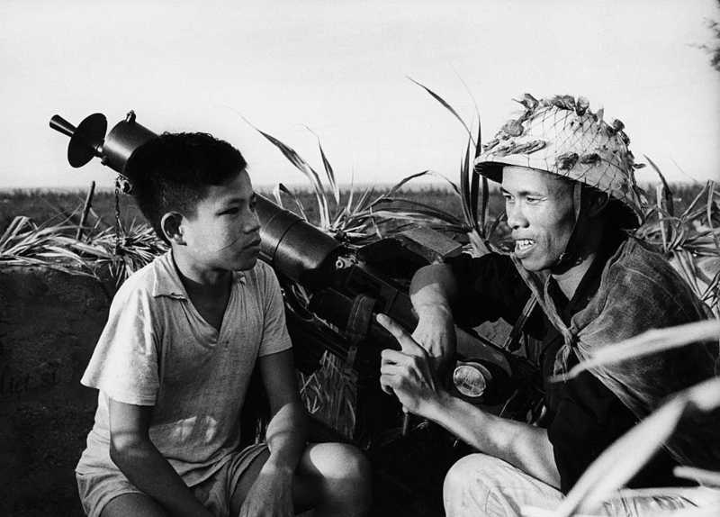 A Machine Gunner and a Boy | Getty Images Photo by Sovfoto